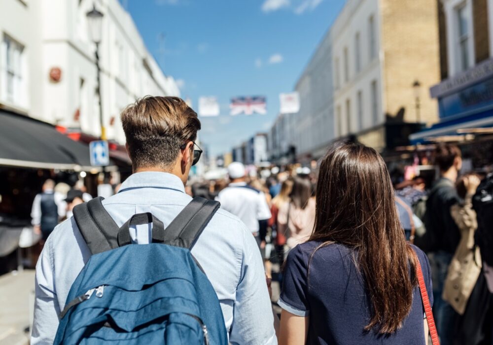 How High Street Retailers Can Win Back Footfall 16 uk london portobello road back view of couple o 2026 01 05 00 52 06 utc Large
