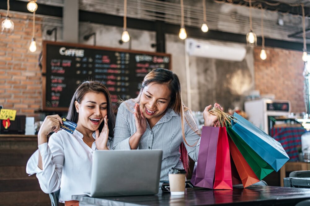The Next Purchasing Paradigm: New Deciders in Zero-Click Commerce Journeys 1 excited women shop online using credit card 2026 01 07 00 54 00 utc Large