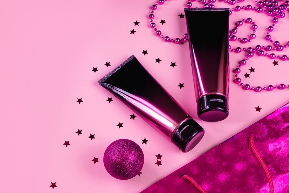 cosmetic tubes and festive confetti on pink surfac 2026 01 08 22 55 44 utc Large
